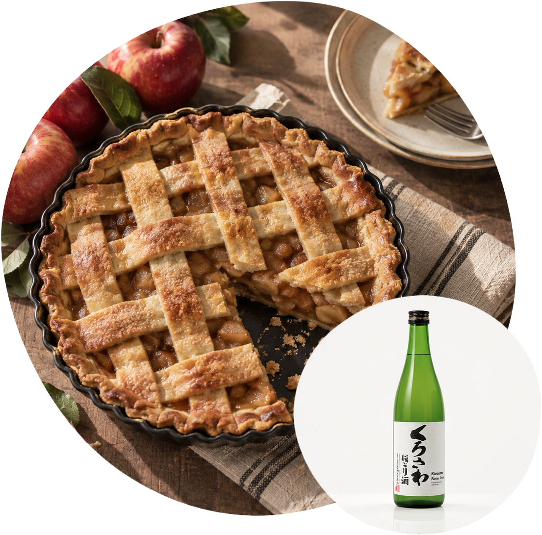 A lattice-topped apple pie with a slice removed, next to a bottle of Japanese sake.