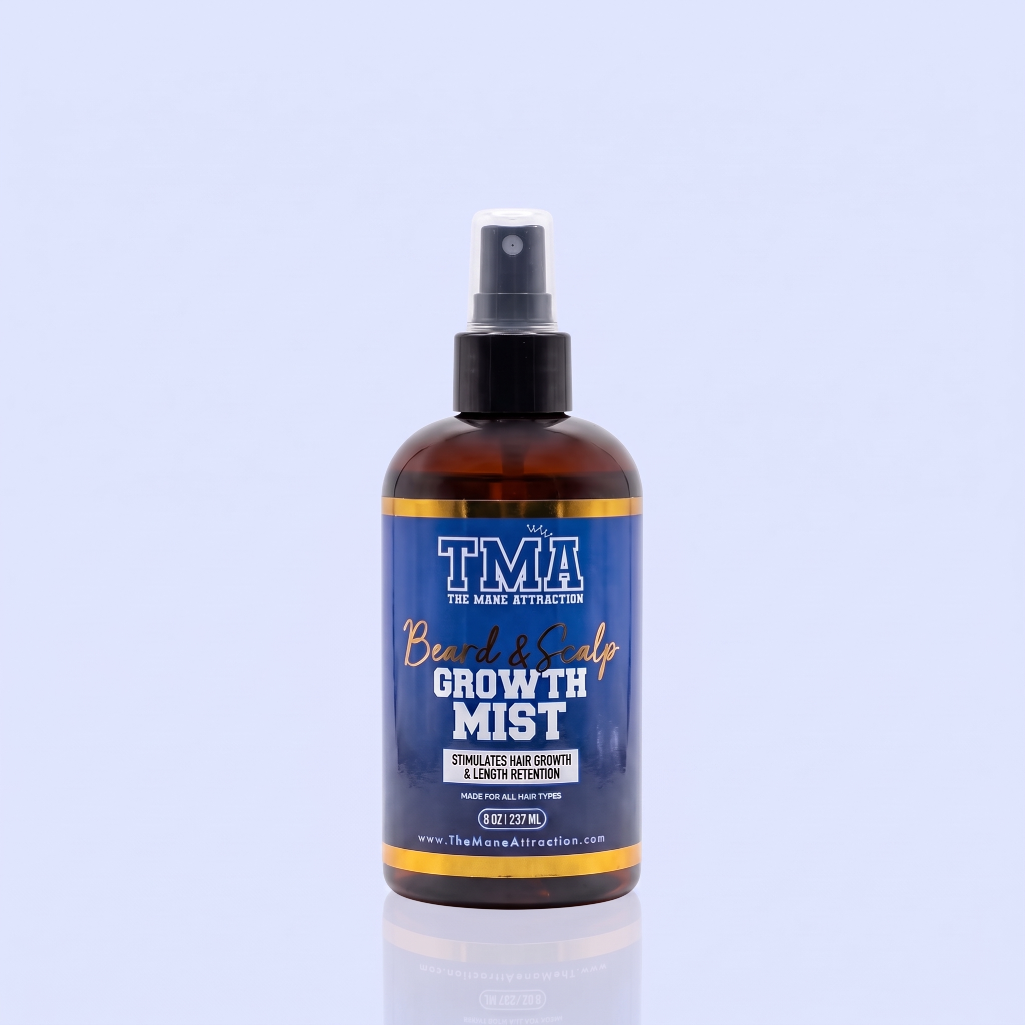 A bottle of The Mane Attraction's Beard & Scalp Growth Mist on a reflective surface.