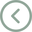 A light green, circular icon with a left-pointing arrow in the center.