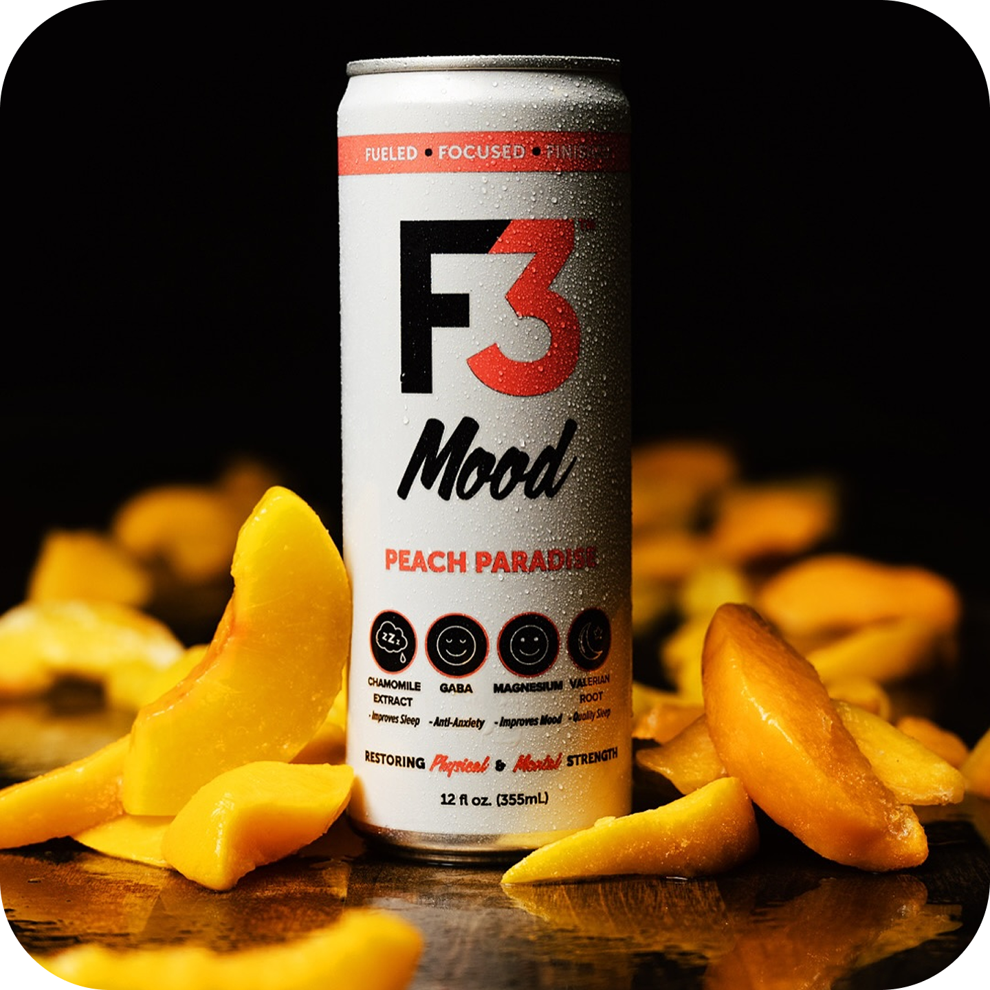 A can of F3 Mood Peach Paradise drink surrounded by peach slices.