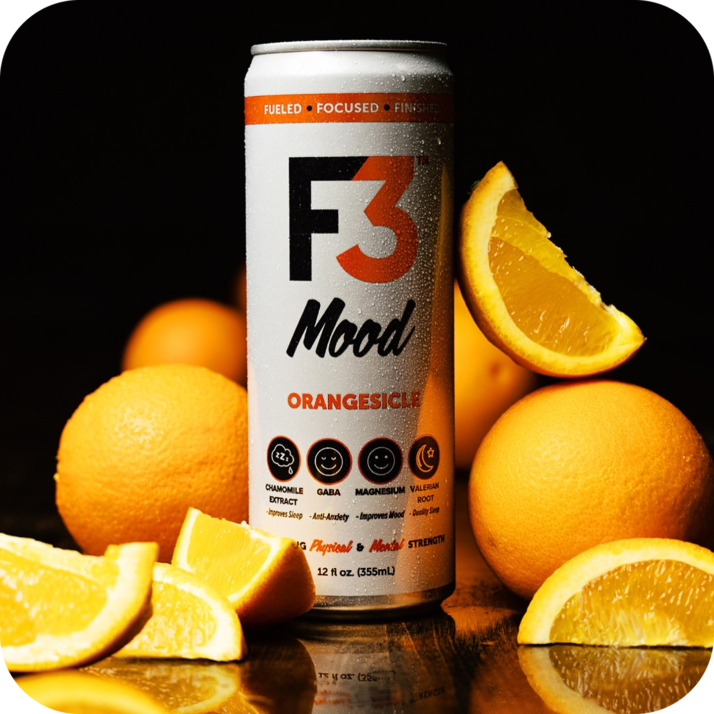 A can labeled 'F3 Mood Orangesicle' surrounded by sliced and whole oranges.