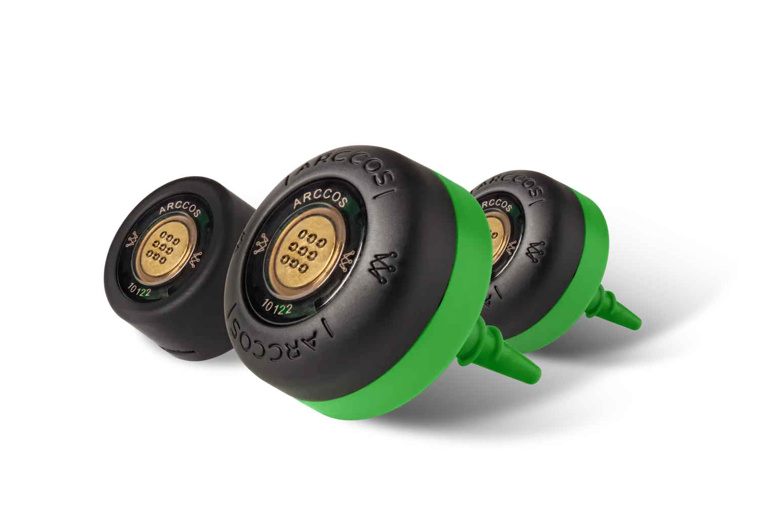 A close-up of three Arccos golf sensors, two with green bases, on a white background.