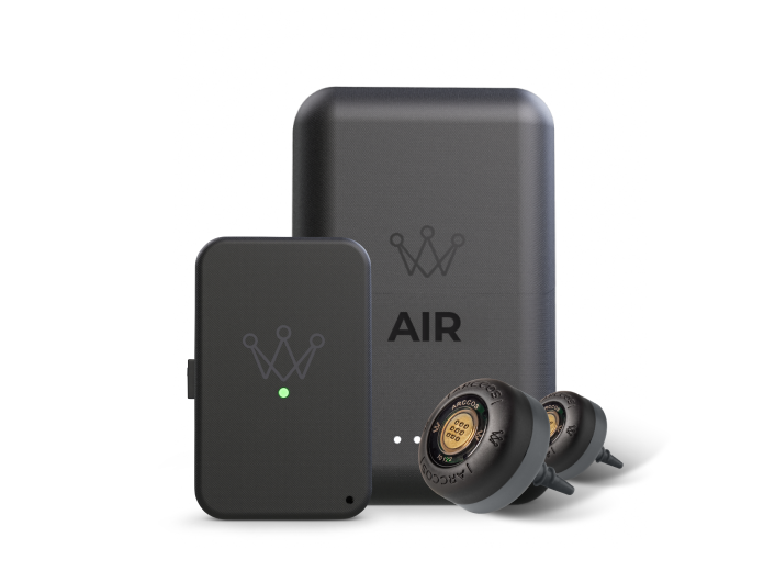 The Arccos AIR golf shot tracking system, including its power bank, link device, and two smart sensors.