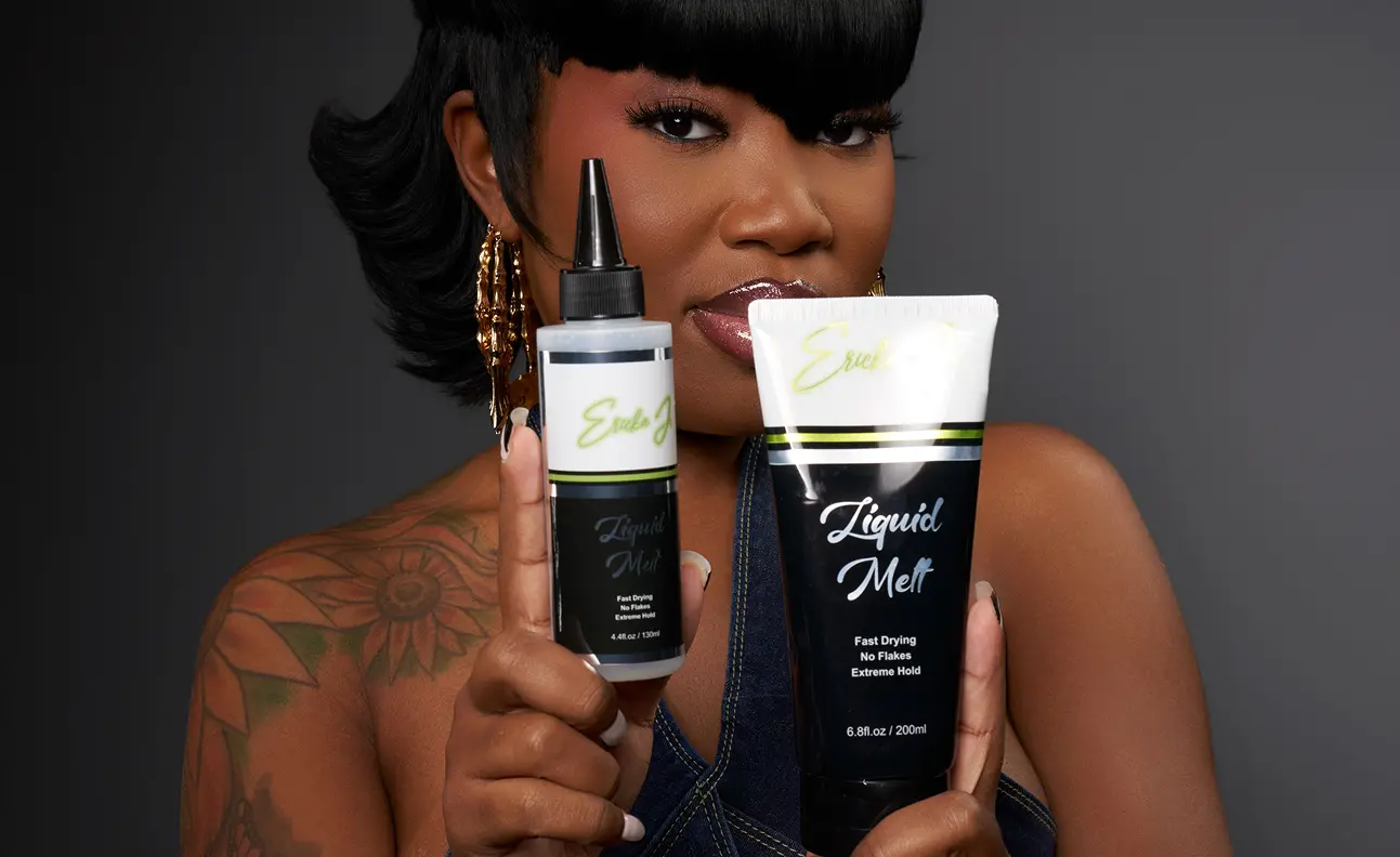 A woman with a sunflower tattoo holds up a bottle and tube of 'Liquid Melt' hair product.