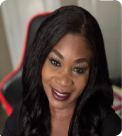 A headshot of a smiling Black woman with long dark hair, looking at the camera.