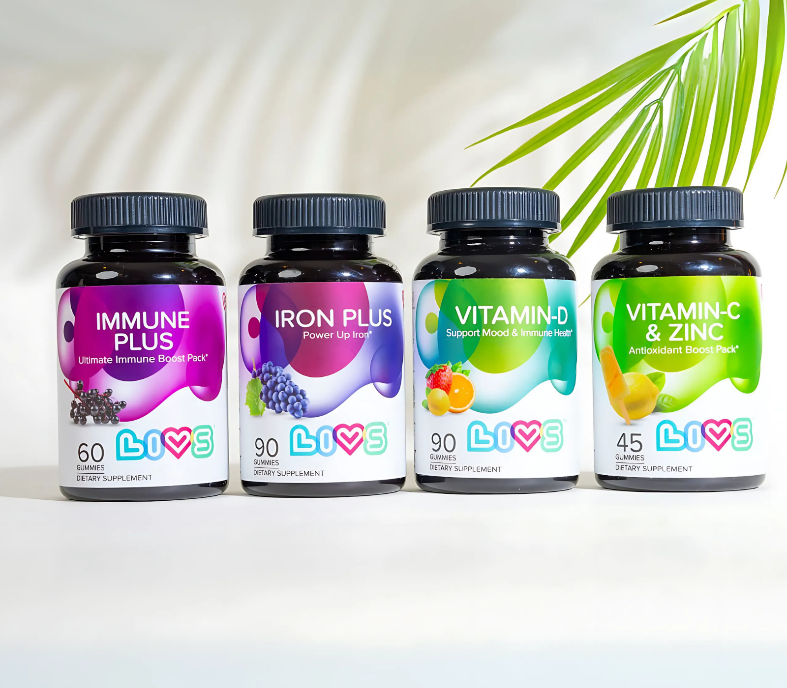 Four supplement bottles labeled Immune Plus, Iron Plus, Vitamin-D, and Vitamin-C & Zinc.