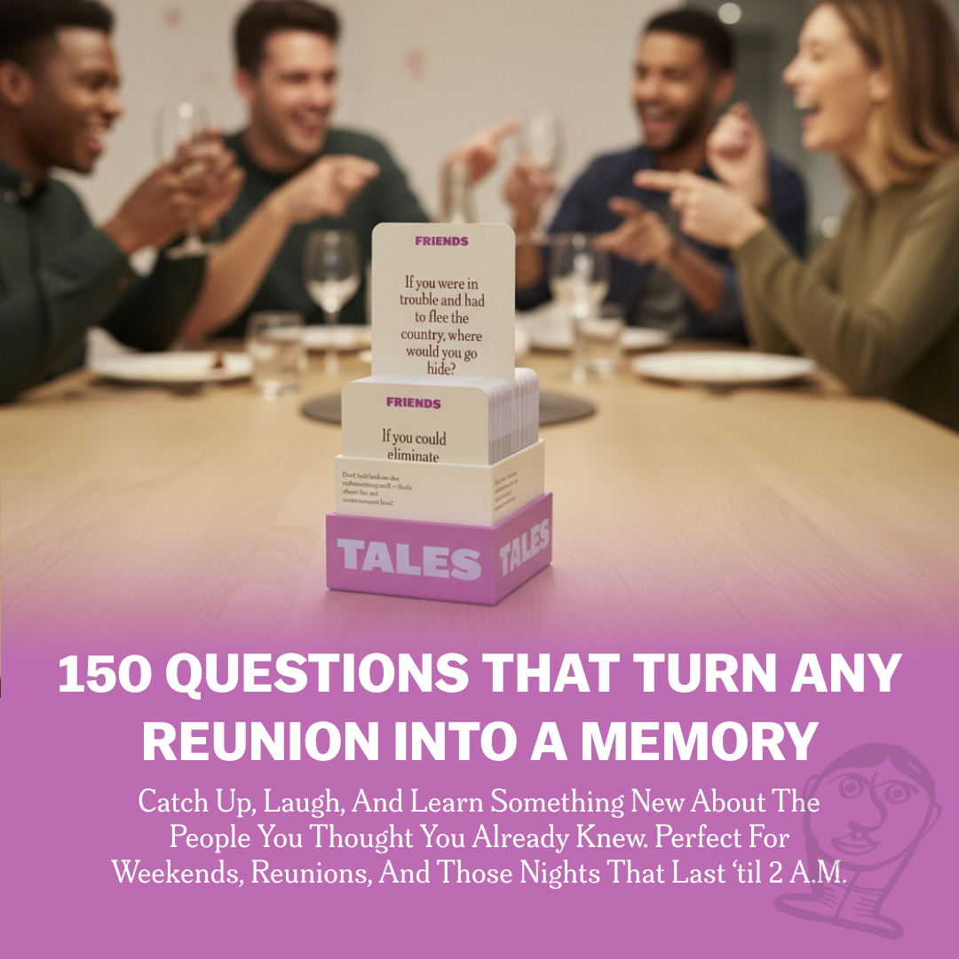 Group of people laughing around a table with a card game box labeled 'TALES'.