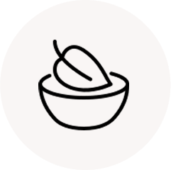 Line drawing of a bowl with a leaf inside.