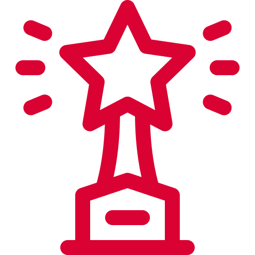 Red star-shaped trophy icon with rays emanating from it.