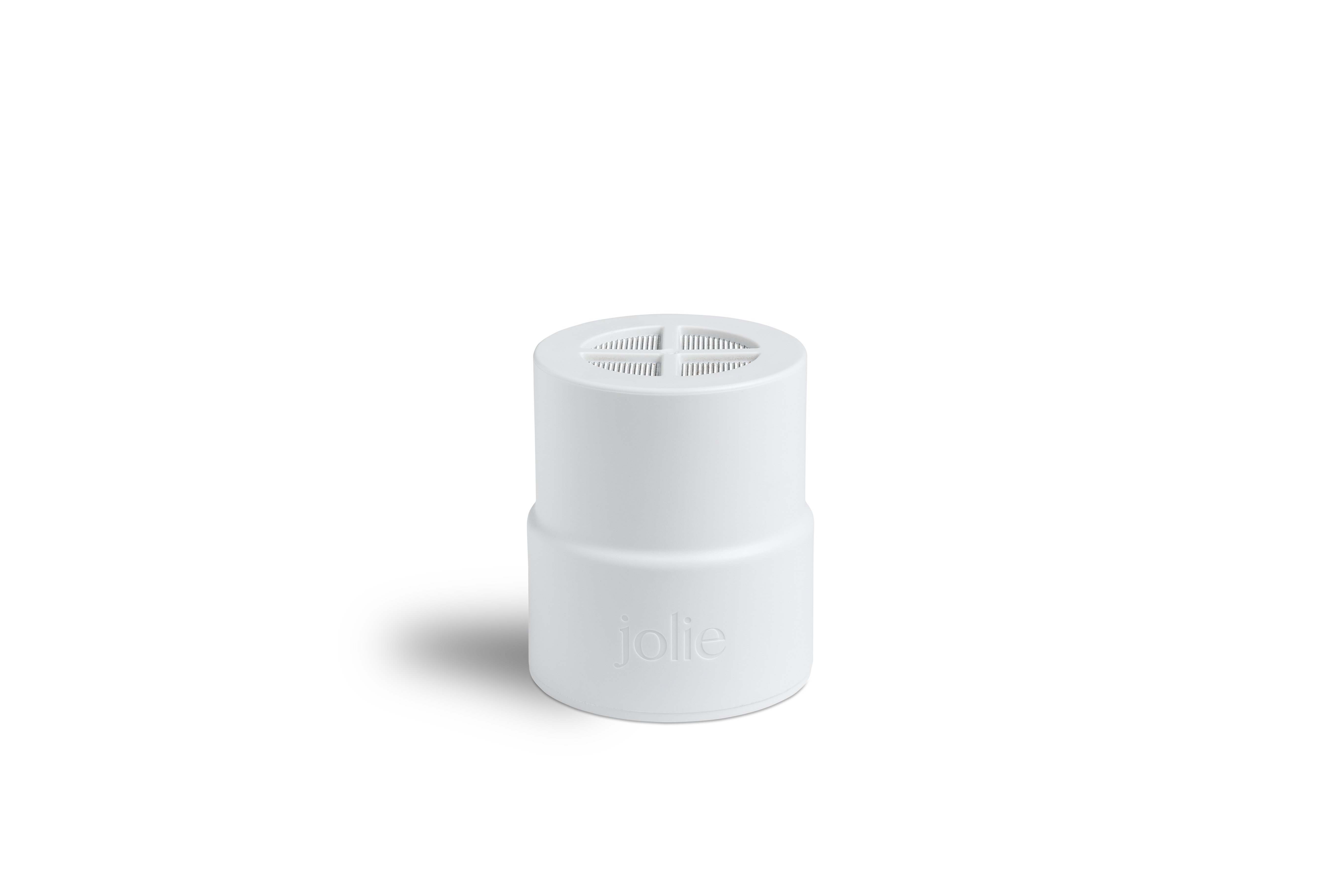 White cylindrical object with a cross-patterned top and 'jolie' text.