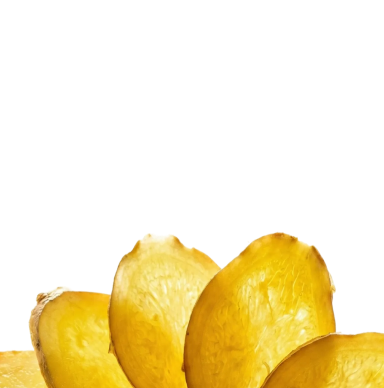 A close-up of several overlapping, thinly-sliced pieces of a yellow root vegetable against a black background.