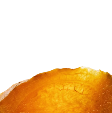 A close-up of a translucent orange slice against a black background.