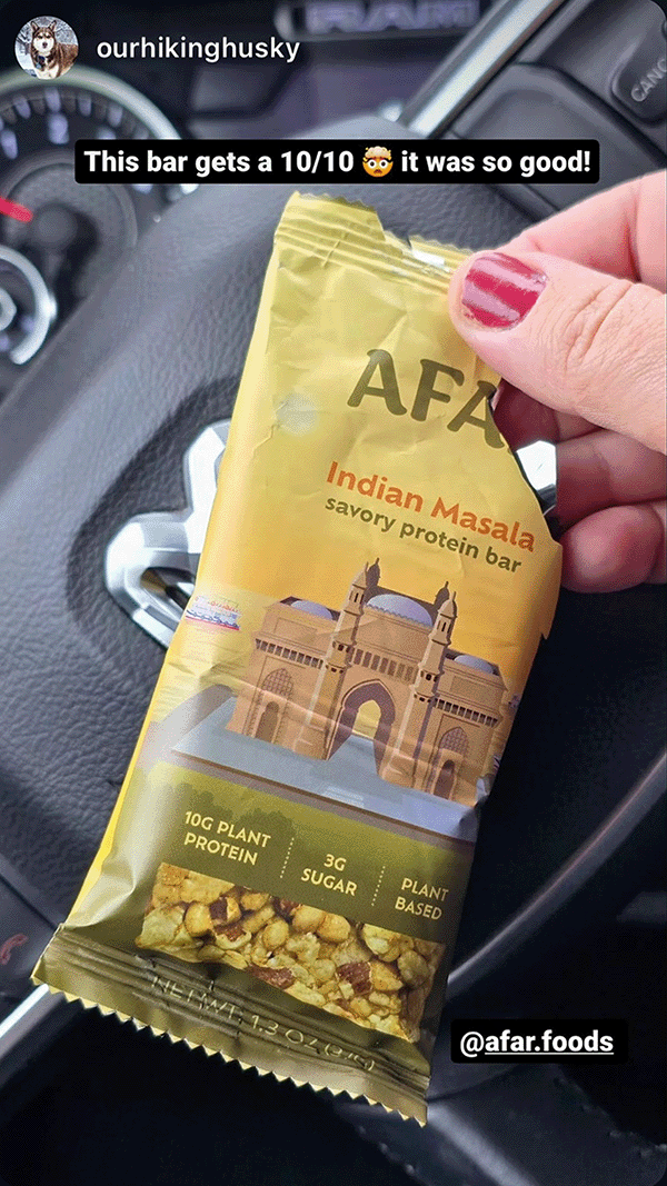Afar savory protein bar in hand in car