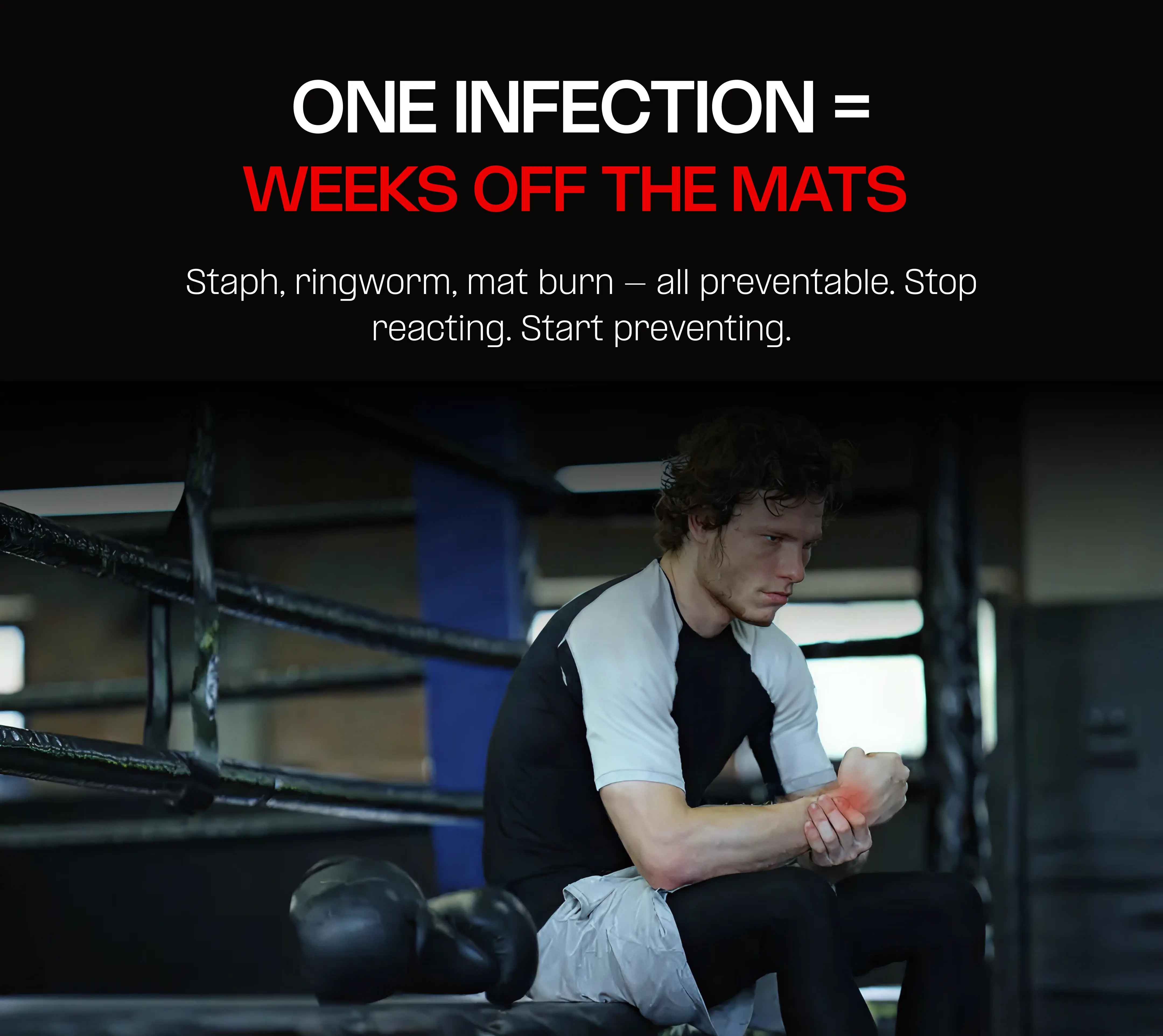 Man sitting in a boxing ring holding his wrist, with warning text above.