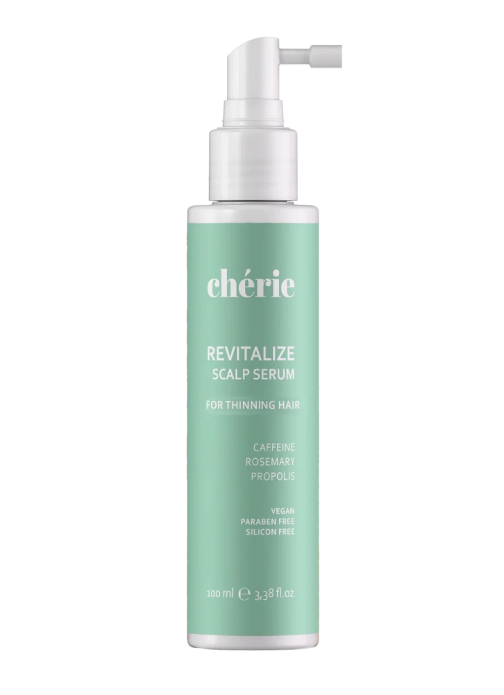 Green bottle of scalp serum with pump dispenser, labeled for thinning hair.