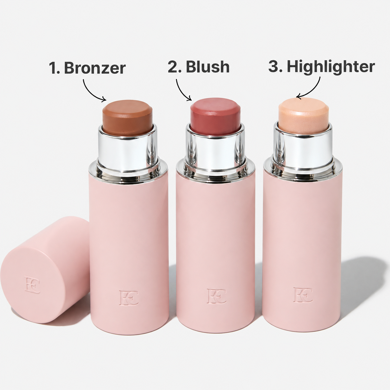 Three makeup sticks in pink tubes, labeled 1. Bronzer, 2. Blush, and 3. Highlighter, against a white background.