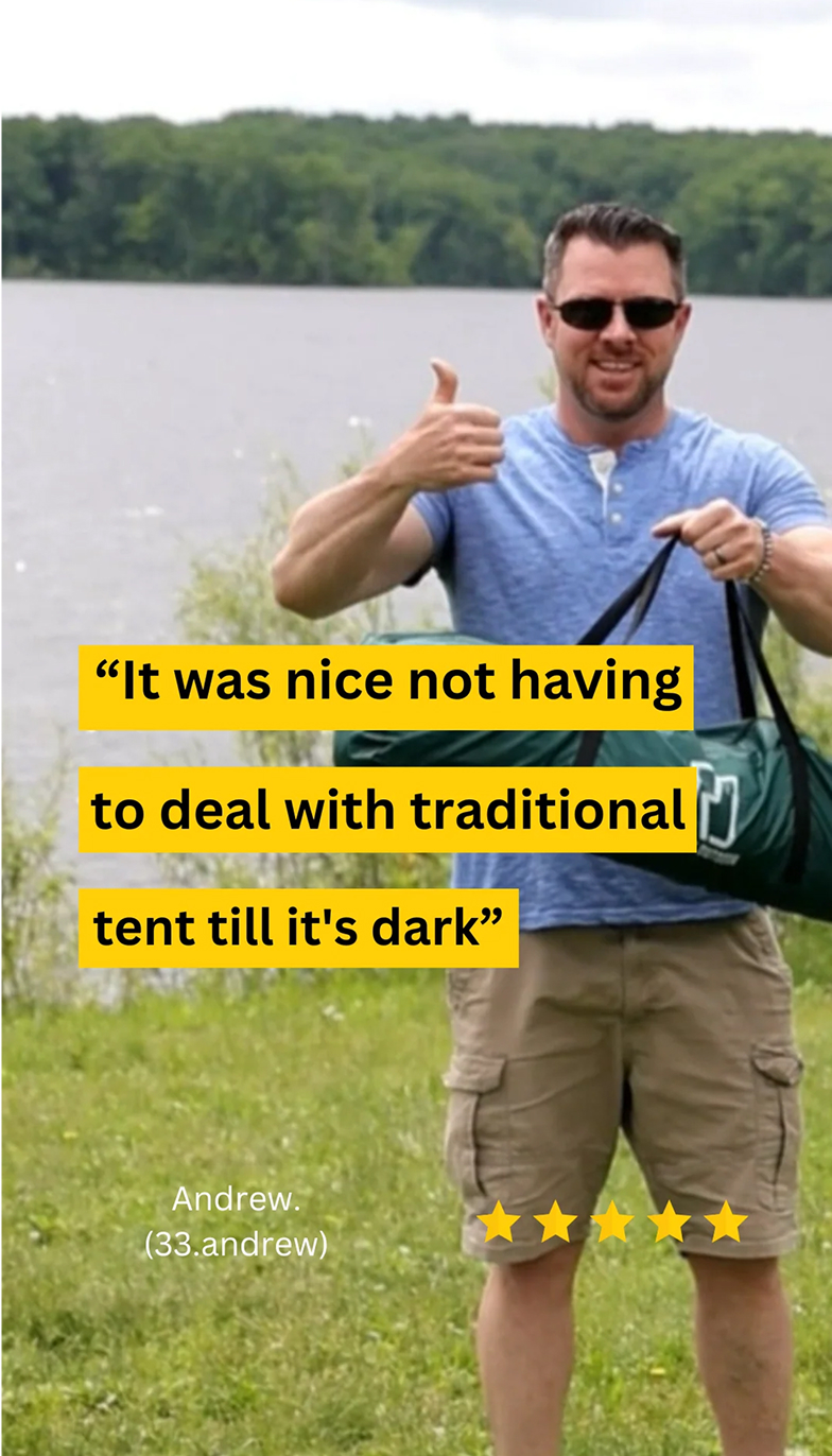 Man standing by a lake holding a bag with a thumbs-up.