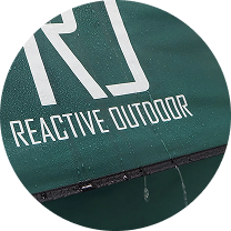 Green surface with the text 'REACTIVE OUTDOOR' beside a large 'R'.