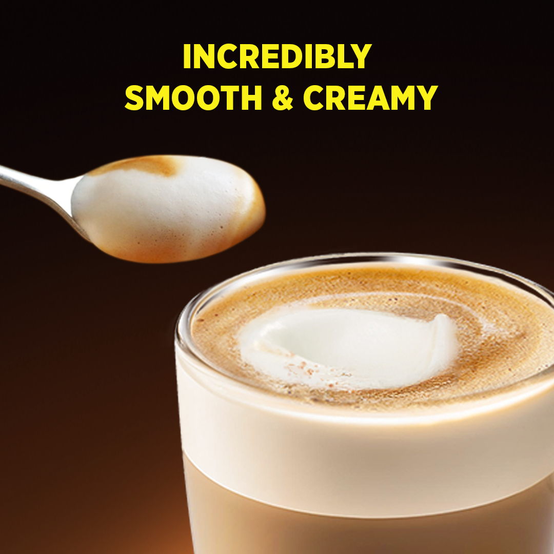 A spoon with foam above a creamy coffee, text reads 'Incredibly Smooth & Creamy'.