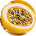 A close-up of a yellow passion fruit sliced in half, showing the seedy pulp inside.