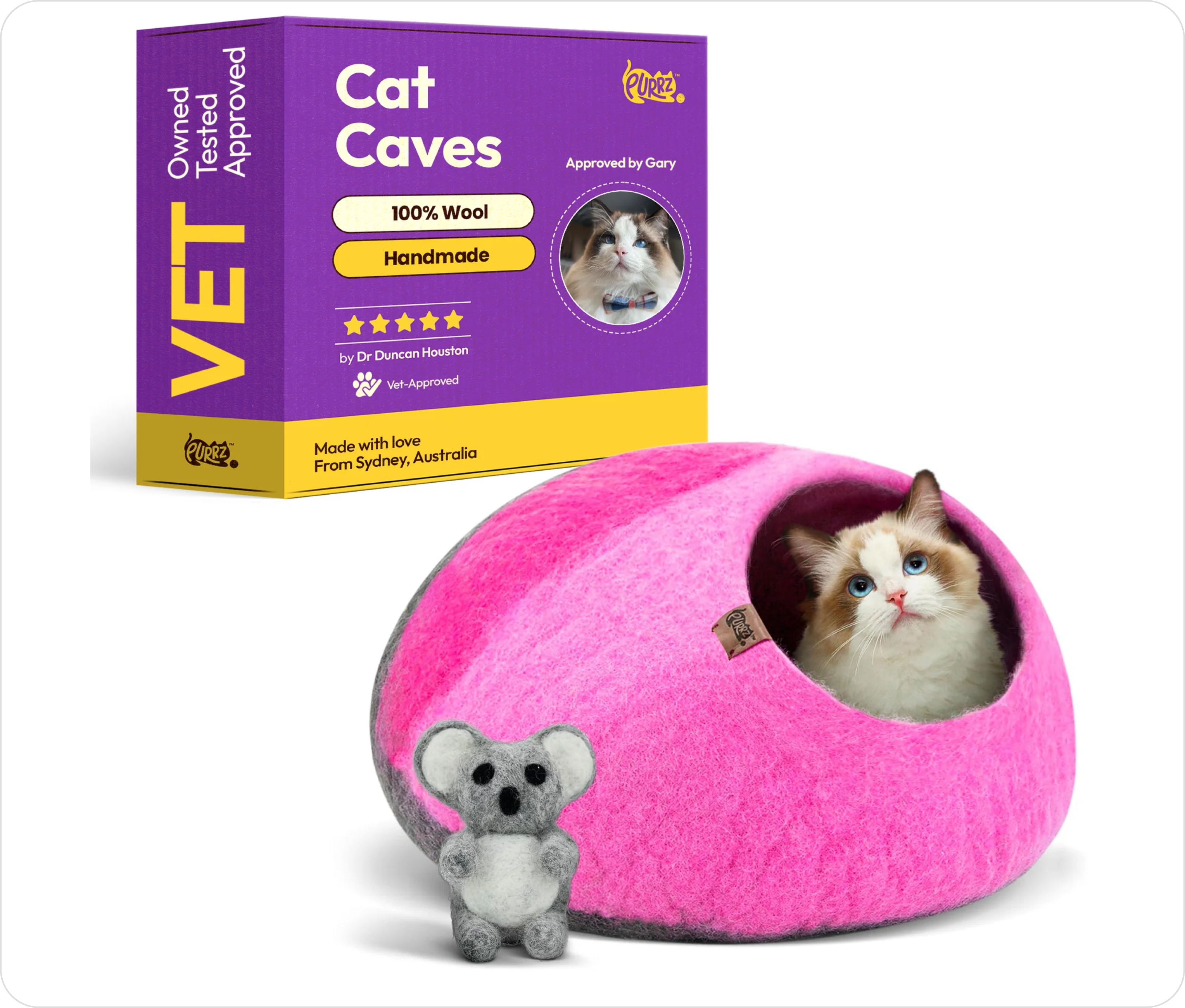 Cat in a pink wool cave with a small koala plush toy.