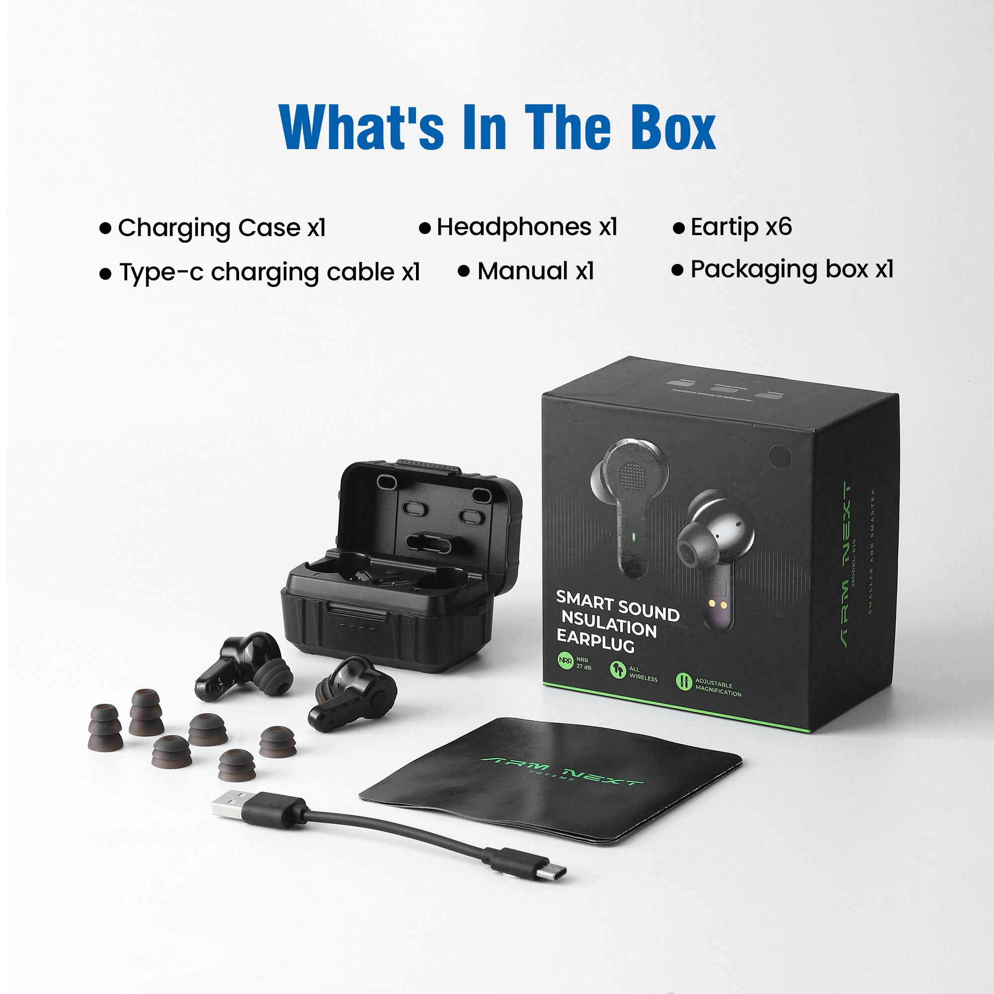 The contents of a box of wireless earbuds, including the case, cable, and extra eartips, next to the packaging.