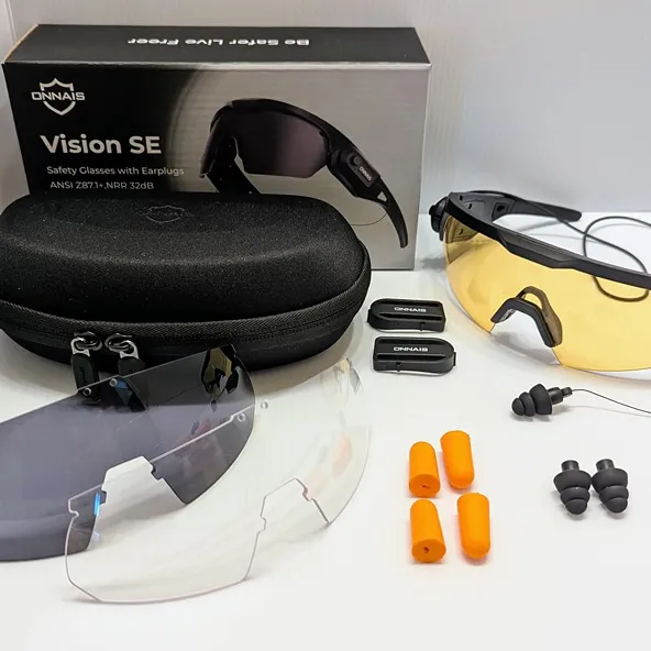 A set of Onnais safety glasses with interchangeable lenses, various earplugs, a case, and the product box.