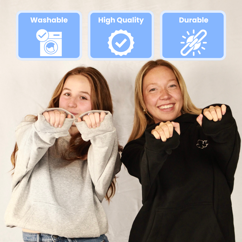 Two people in hoodies with icons for washable, high quality, and durable above them.