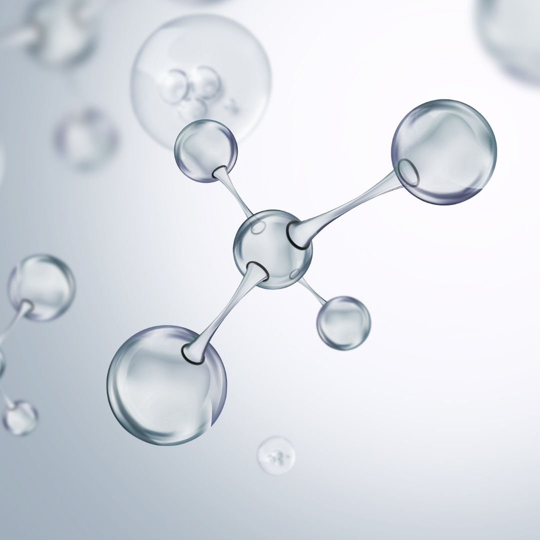A 3D illustration of a transparent, glass-like molecule on a light background.