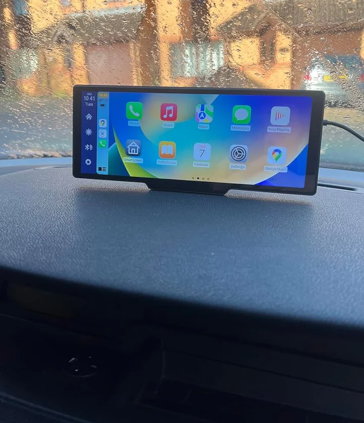 Dashboard-mounted screen displaying apps in a car interior.