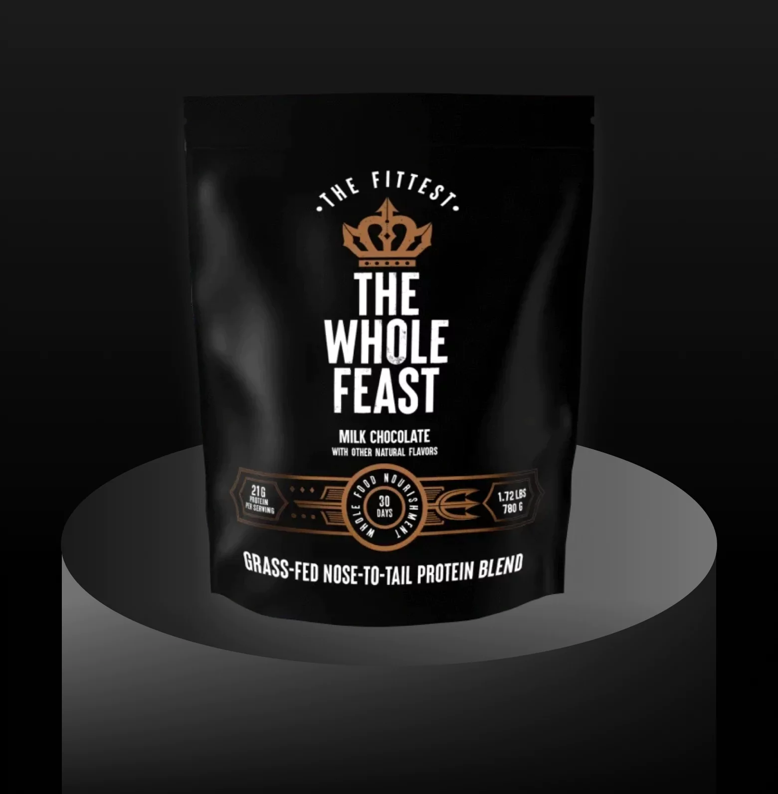 Black protein powder bag labeled 'The Whole Feast' with crown logo on a dark background.