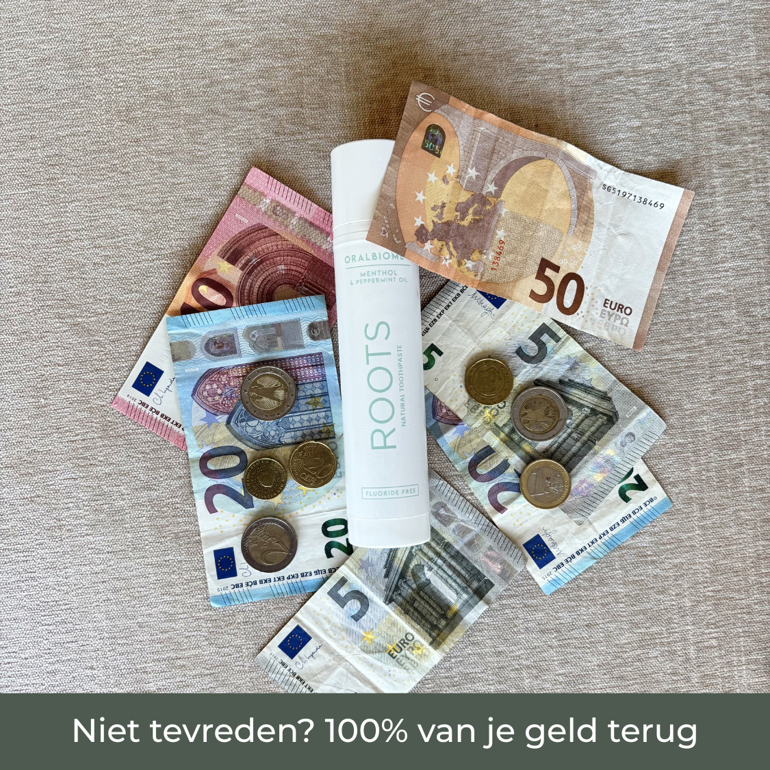 A tube of Roots natural toothpaste lying on a pile of Euro banknotes and coins.