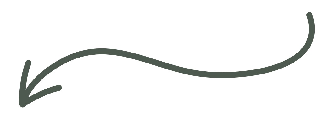 A hand-drawn, wavy, dark green arrow pointing down and to the left on a white background.