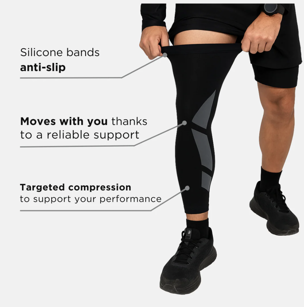 Person wearing black compression leggings with highlighted anti-slip and support features.