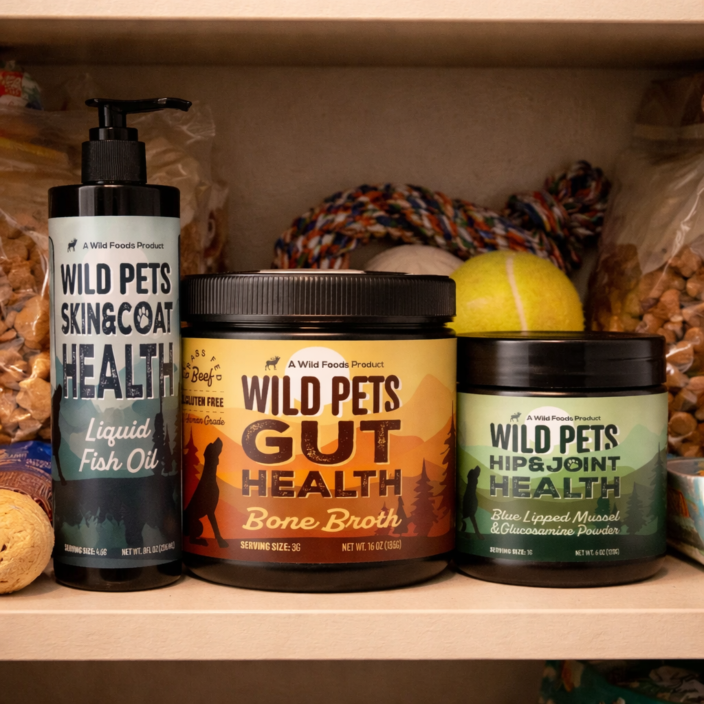 Three Wild Pets supplement containers for skin, gut, and joint health on a pantry shelf with pet toys.