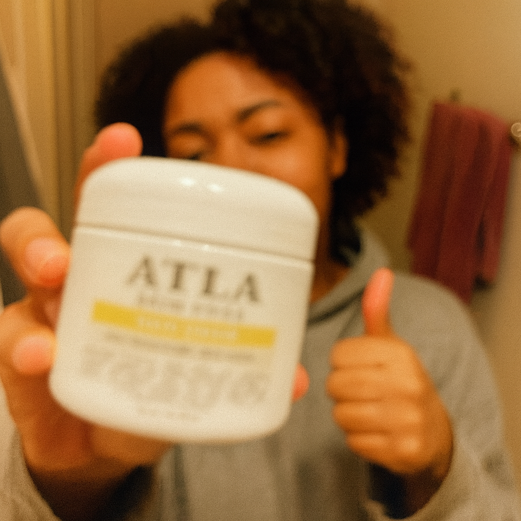 Person holding a jar of ATLA product with thumb up.