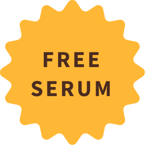 An orange, star-shaped badge with the words 'FREE SERUM' written in the center in a brown font.