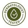 A green circular seal that reads 'Dermatologist Tested' with a droplet and checkmark icon in the center.