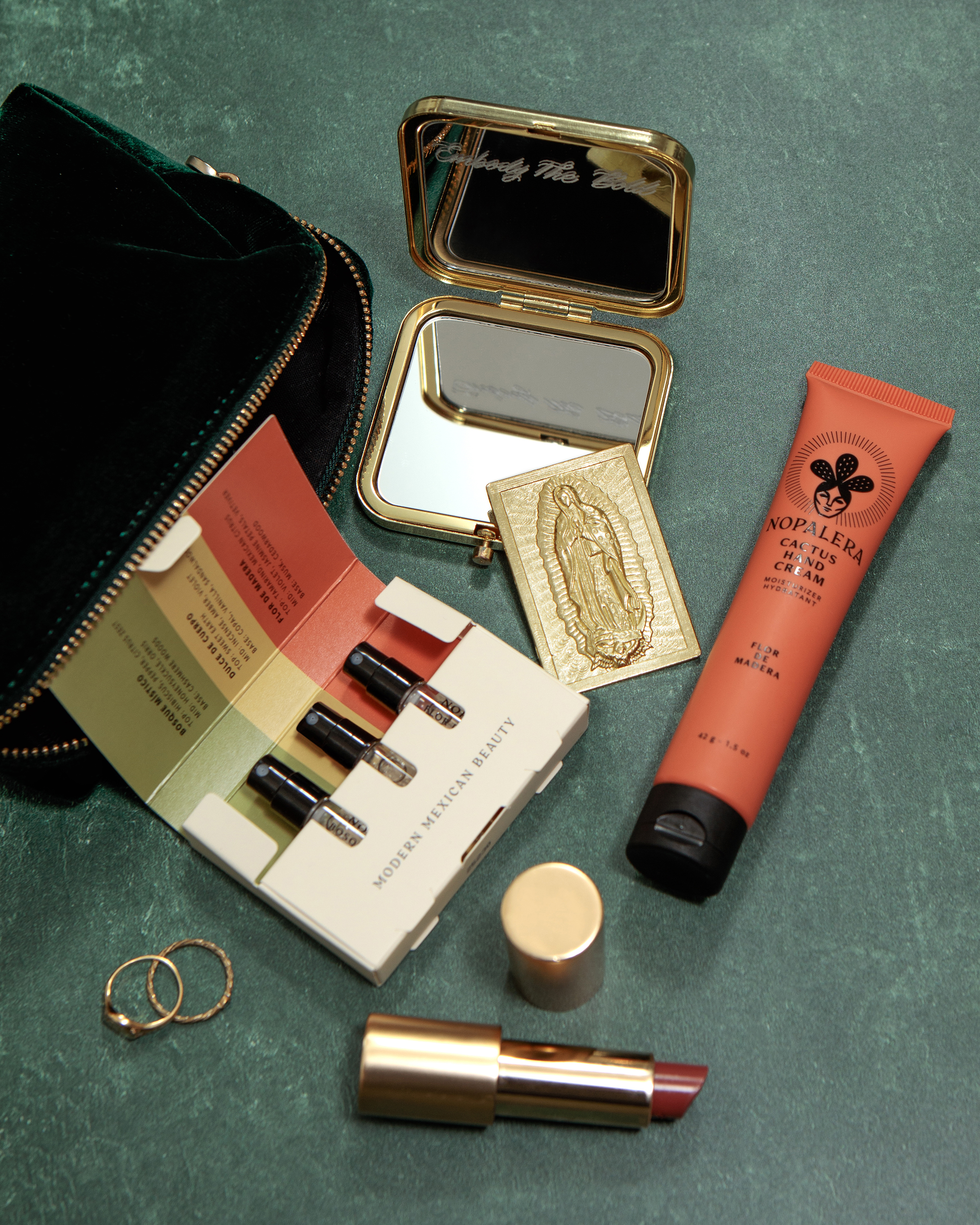 Nopalera fragrance set with full size perfume and beauty products arranged together.