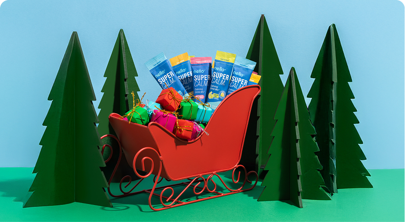 Red sleigh with gifts and packets, surrounded by green paper trees.