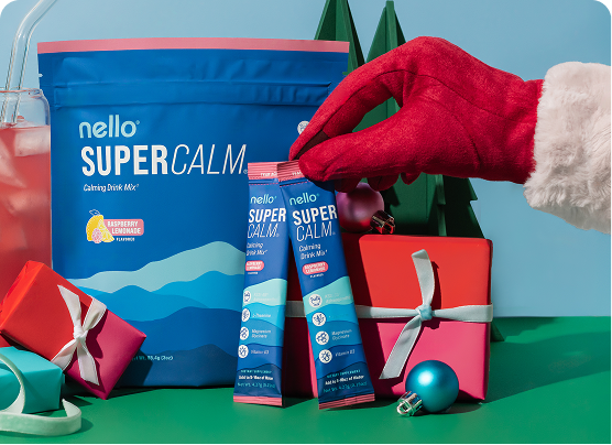 Festive scene with drink mix packets and wrapped gifts.