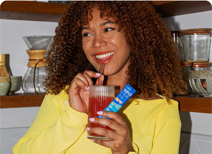 Enjoying a glass of Oluna Calming Drink Mix