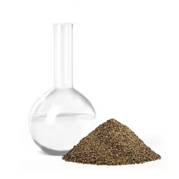 Glass flask and pile of brown powder on white background.