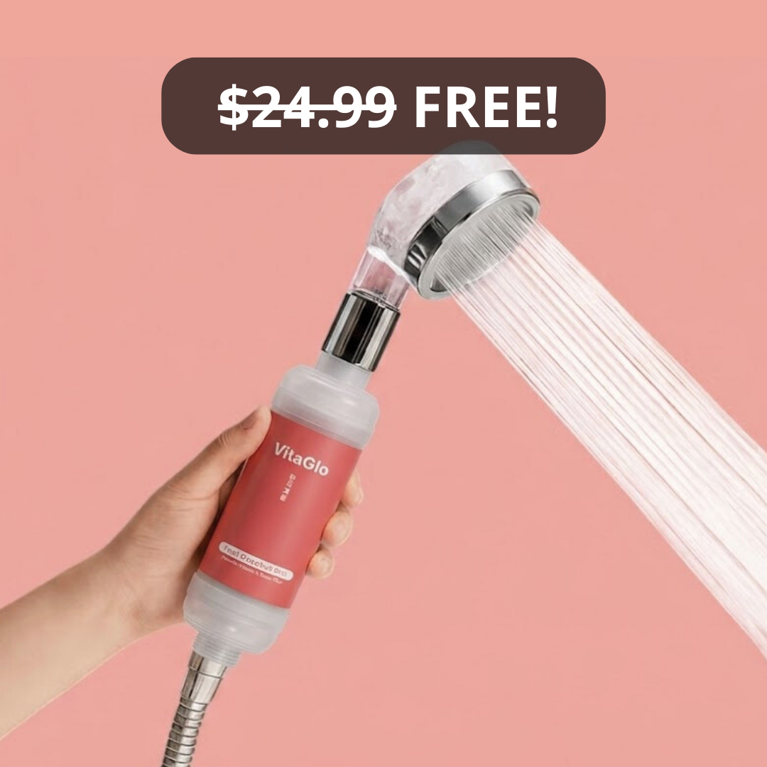 Hand holding a shower filter with water flowing, against a coral background.
