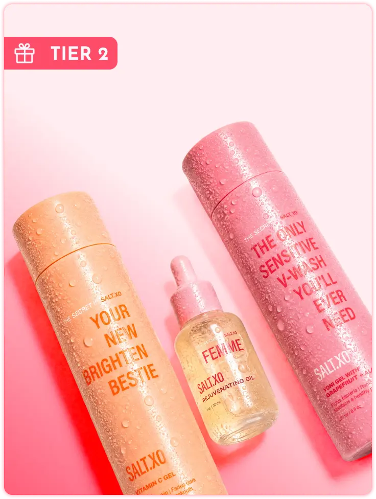 Three Salt.xo brand skincare products—a gel, a wash, and an oil—covered in water droplets.