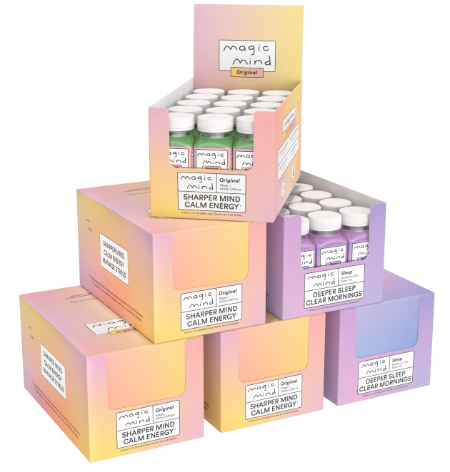 Stack of colorful boxes containing small bottles labeled 'Magic Mind.'