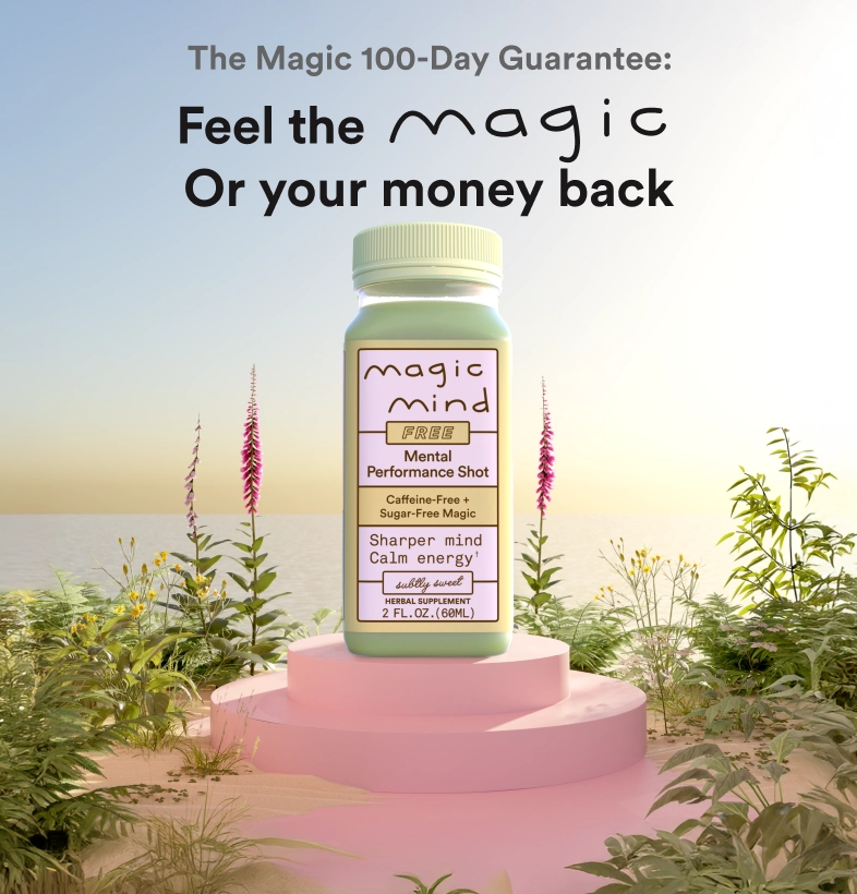 Bottle labeled 'Magic Mind' on a pink platform surrounded by plants.