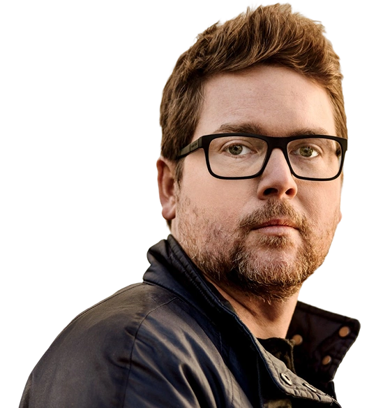 Man with glasses and a beard wearing a dark jacket.