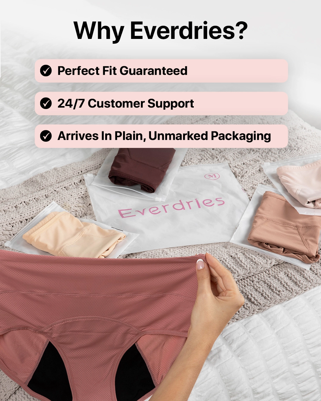 Various colored underwear on a bed with Everdries packaging.