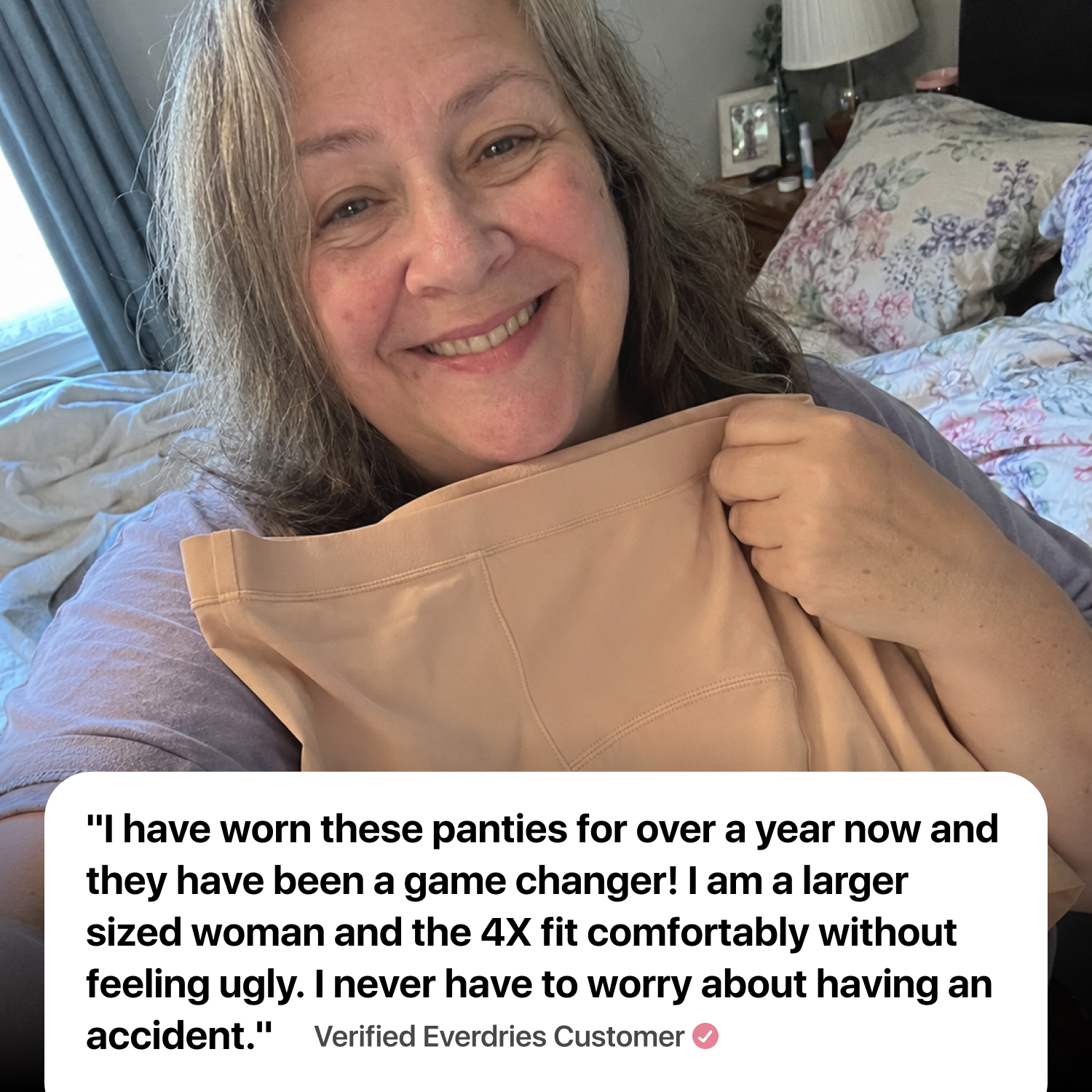 A smiling woman in a bedroom holds up a pair of tan panties, with a testimonial text overlay.